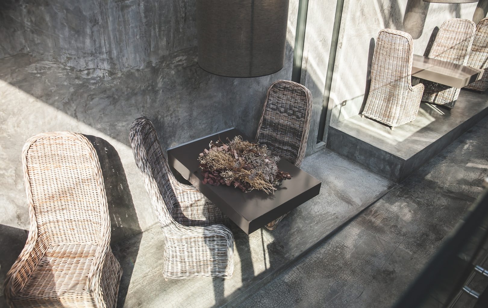 square brown wooden table and two chairs